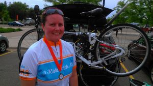 Picture of Mary and her bike after riding MS 150